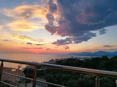 a view of a sunset from a balcony at Carefree Apartments in Ulcinj