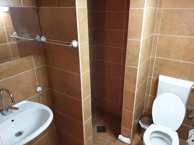 a bathroom with a toilet and a sink at Smurf's house in Budva