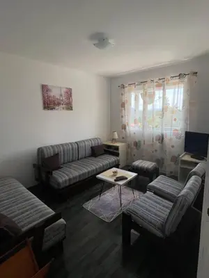 a living room with a couch and a table at Apartments Matija in Sutomore