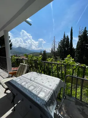 a patio with a table and chairs on a balcony at Apartments Matija in Sutomore