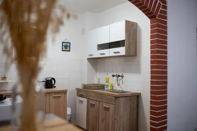 a kitchen with a sink and a counter top at Apartments Matija in Sutomore