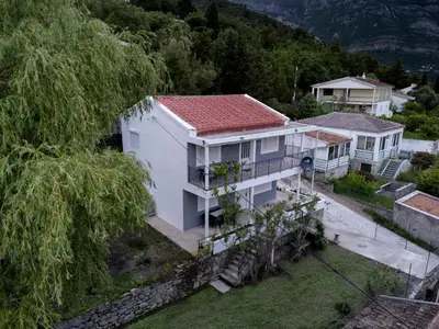 an aerial view of a white house with a yard at Apartments Matija in Sutomore
