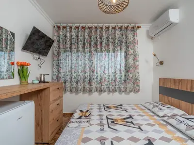 a room with a bed and a window at Apartments Nona in Ulcinj