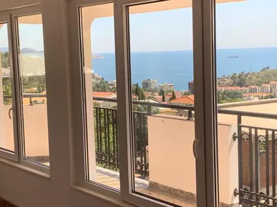 a view of the ocean from a window at Best View Apartment in Sutomore