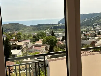 a view of a city from a balcony at Best View Apartment in Sutomore
