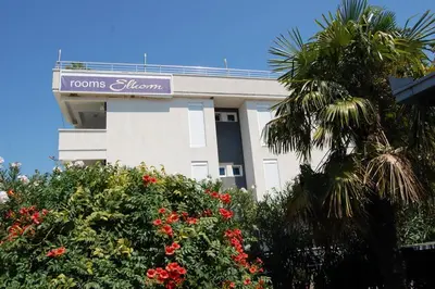 a building with a sign for a hotel at Vila Elkom, Apartment 5 in Ulcinj