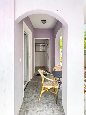 a patio with two chairs and a table on a porch at Appartment Frick in Sutomore