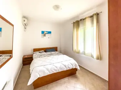 a bedroom with a bed and a window at Appartment Frick in Sutomore