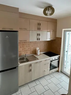 a kitchen with a sink and a refrigerator at Apartment Xenia in Petrovac na Moru
