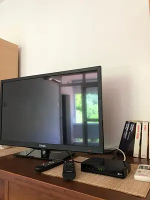 a computer monitor sitting on top of a desk at Ćetković 1 in Petrovac na Moru