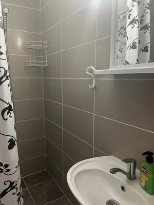 a bathroom with a sink and a mirror at SeaAdrik in Bar