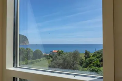 a view of the ocean from a window at Apartments Bonazza in Petrovac na Moru