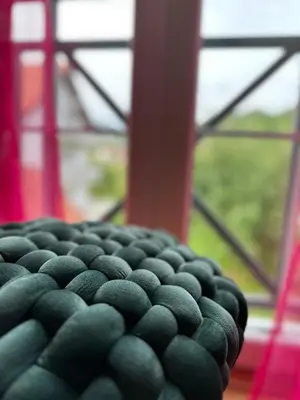 a close up of a chair in front of a window at Apartman AURORA CETINJE in Cetinje