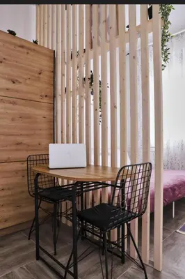 a table with two chairs and a laptop on it at Studio apartment, 5 minutes to the beach in Bar
