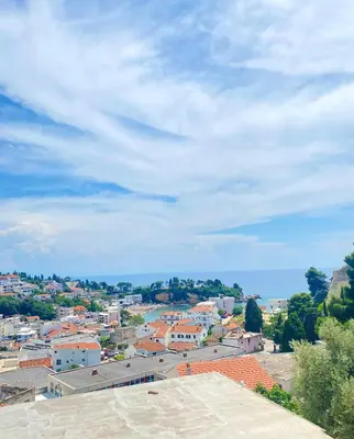 a view of a city with the ocean in the background at NOA Guest House in Ulcinj