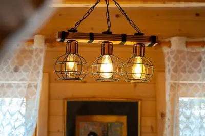 a cluster of lights hanging from a ceiling at Holiday Home MIA in Rijeka Crnojevića