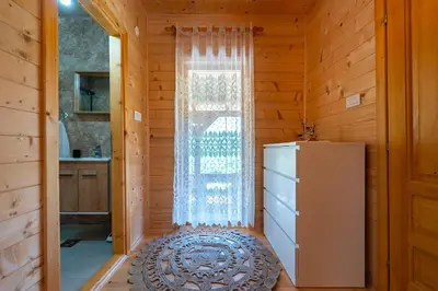 a small room with a window and a refrigerator at Holiday Home MIA in Rijeka Crnojevića