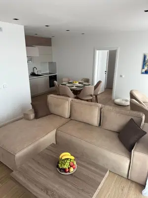a living room with a couch and a plate of fruit at Sunny&calmhouse in Bar