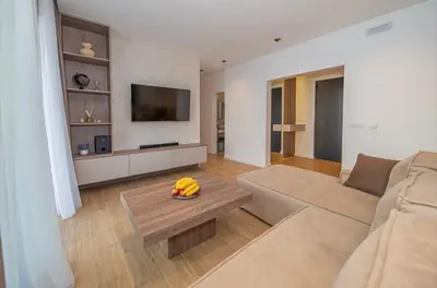 a living room with a couch and a table at Sunny&calmhouse in Bar