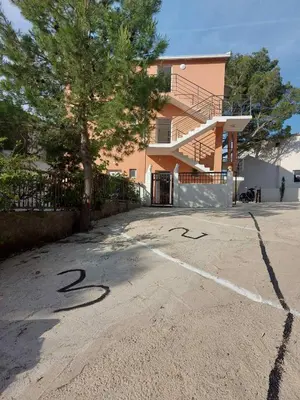a parking lot with the number painted on it at Crni Bor Sutomore in Sutomore