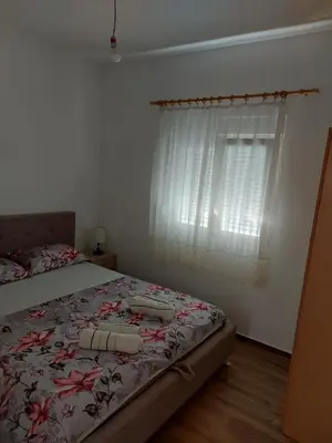a bedroom with a bed and a window at Crni Bor Sutomore in Sutomore