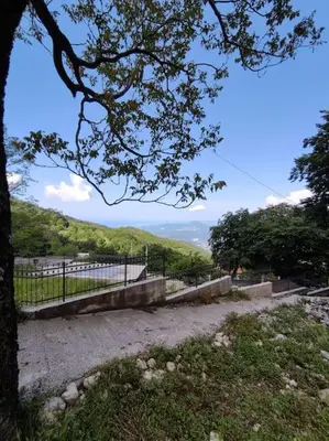 a park with a fence and a tree in the foreground at Nature Escape Montenegro in Kotor