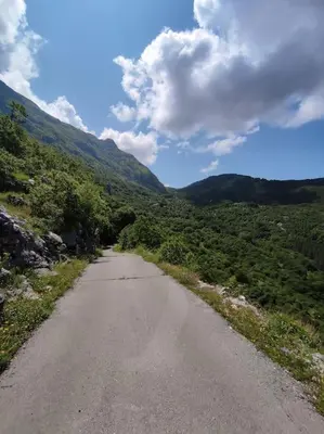 a dirt road with mountains in the distance at Nature Escape Montenegro in Kotor