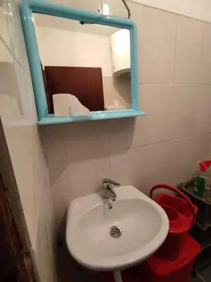 a bathroom with a white sink and a mirror at Nature Escape Montenegro in Kotor
