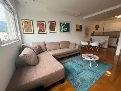 a living room with a couch and a table at Apartment with Seaview Zetagradnja in Bar