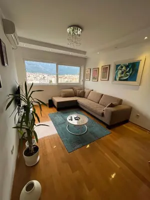a living room with a couch and a table at Apartment with Seaview Zetagradnja in Bar