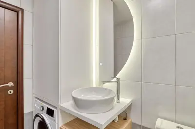 a white bathroom with a sink and a mirror at Blue Lagoon in Petrovac na Moru
