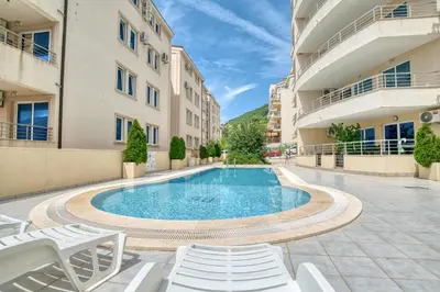 a swimming pool in the middle of a building at Blue Lagoon in Petrovac na Moru