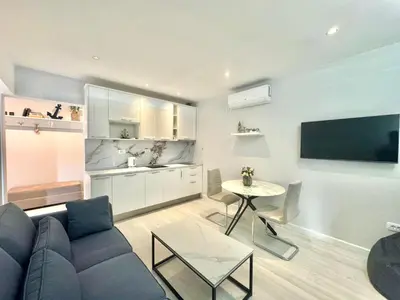a living room with a couch and a table at Family Apartments Stefan in Budva