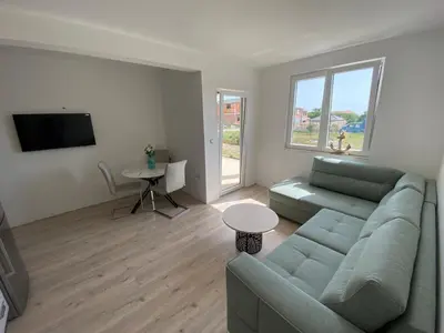 a living room with a couch and a table at Family Apartments Stefan in Budva