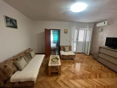 a living room with a couch and a table at Budva Apartments in Budva