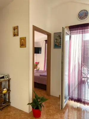 a room with a door leading to a bedroom at Apartment Alex in Kotor