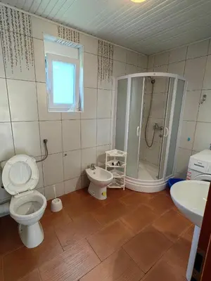a bathroom with a toilet and a shower and a sink at Romantic auch mit Kindern in Sutomore
