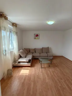 a living room with a couch and a table at Romantic auch mit Kindern in Sutomore