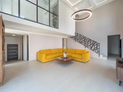 a living room with a yellow couch and a table at Seaview Villa with pool-Vanja in Budva