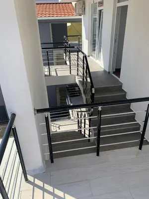 a group of stairs in a building with at LamijaApartmani 1 in Sutomore