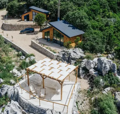 an overhead view of a house on a mountain at Olive Hills Holiday homes 1 & 2 in Bar