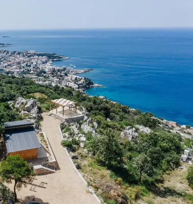 a house on a hill overlooking the ocean at Olive Hills Holiday homes 1 & 2 in Bar
