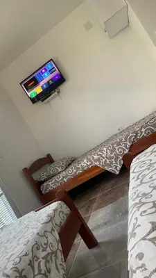 a living room with a tv on the wall at LamijaApartmani in Sutomore