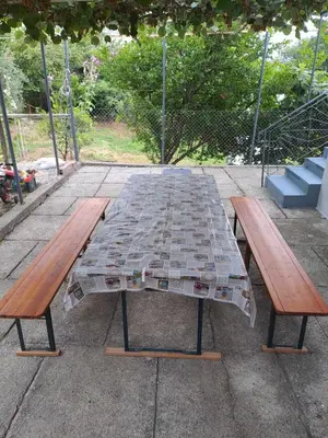 a picnic table with two benches and a mosaic top at apartman ANAMI in Bar