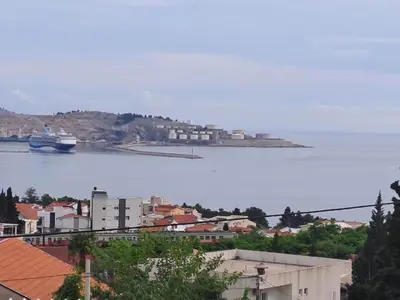 a cruise ship in a large body of water at apartman ANAMI in Bar