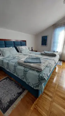 two large beds in a room with at HeArt of Old Town Guesthouse in Podgorica