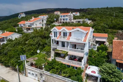 an aerial view of a house in a town at Sea Oasis Apartments - Milosevic in Kotor