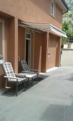 two chairs sitting on the outside of a building at Apartments Moskov in Kotor