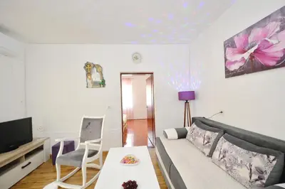 a living room with a couch and a tv at Apartman Stefan in Kotor
