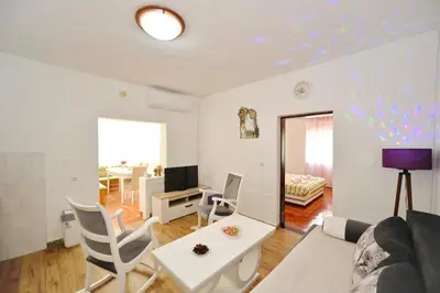 a living room with a couch and a table at Apartman Stefan in Kotor